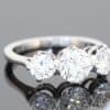 A timeless three-stone diamond ring, beautifully crafted in platinum and designed to celebrate the enduring appeal of diamonds. With a substantial centre stone framed by two complementary diamonds, this elegant design balances presence and proportion, making it a sophisticated choice for an engagement ring or an important addition to a fine jewellery collection.