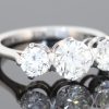 A timeless three-stone diamond ring, beautifully crafted in platinum and designed to celebrate the enduring appeal of diamonds. With a substantial centre stone framed by two complementary diamonds, this elegant design balances presence and proportion, making it a sophisticated choice for an engagement ring or an important addition to a fine jewellery collection.