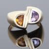 Distinctive and contemporary in spirit, this modernist two-stone ring celebrates the beauty of contrasting gemstones and unconventional design. Its asymmetrical composition reflects a sculptural approach to jewellery, creating a piece with individuality and artistic character.