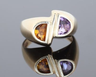 Distinctive and contemporary in spirit, this modernist two-stone ring celebrates the beauty of contrasting gemstones and unconventional design. Its asymmetrical composition reflects a sculptural approach to jewellery, creating a piece with individuality and artistic character.