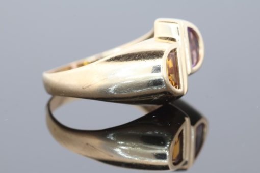 Distinctive and contemporary in spirit, this modernist two-stone ring celebrates the beauty of contrasting gemstones and unconventional design. Its asymmetrical composition reflects a sculptural approach to jewellery, creating a piece with individuality and artistic character.