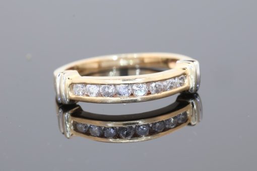 Elegant and versatile, this diamond band combines the timeless appeal of gold with the enduring brilliance of diamonds. Its classic design makes it a beautiful addition to a fine jewellery collection, equally suited to everyday wear or marking a special occasion.