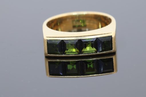 A distinctive Irish gold ring by renowned jewellery designer Rudolph Heltzel, celebrated for his artistic approach to jewellery and his appreciation of fine materials. This elegant creation combines the warmth of gold with the rich colour of tourmalines, reflecting a confident and considered approach to modern jewellery design.
