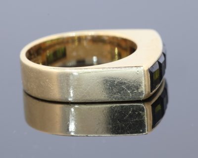 A distinctive Irish gold ring by renowned jewellery designer Rudolph Heltzel, celebrated for his artistic approach to jewellery and his appreciation of fine materials. This elegant creation combines the warmth of gold with the rich colour of tourmalines, reflecting a confident and considered approach to modern jewellery design.