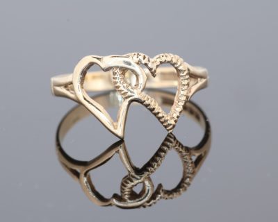 A charming intertwined hearts ring, symbolising connection, affection and enduring bonds. The heart motif has long held a special place in jewellery design, making this an appealing piece to wear as a personal expression of love or to give as a meaningful gift.
