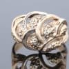 Bold and sculptural, this 9kt gold dress ring showcases the beauty of flowing lines and contemporary design. Its generous domed form gives the piece a distinctive presence, while the wave-like pattern adds movement and visual interest.