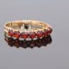 A charming garnet ring, combining the warm lustre of gold with the rich red tones of this classic gemstone. Garnets have been treasured in jewellery for centuries, admired for their depth of colour and enduring appeal.