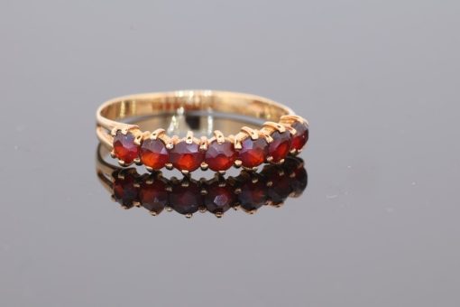 A charming garnet ring, combining the warm lustre of gold with the rich red tones of this classic gemstone. Garnets have been treasured in jewellery for centuries, admired for their depth of colour and enduring appeal.