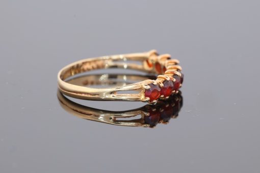 A charming garnet ring, combining the warm lustre of gold with the rich red tones of this classic gemstone. Garnets have been treasured in jewellery for centuries, admired for their depth of colour and enduring appeal.