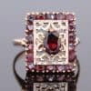 Elegant and richly detailed, this garnet panel ring combines the warm lustre of gold with the deep red tones of garnets. Its decorative filigree work lends the piece a distinctive character, showcasing the enduring appeal of intricate jewellery craftsmanship.