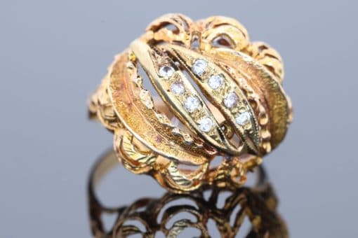 Bold and elegant, this 14kt gold dress ring showcases the enduring appeal of the bombé style. Characterised by its rounded, domed silhouette, the bombé design creates a sculptural presence on the hand, combining substantial proportions with the refined sparkle of diamonds.