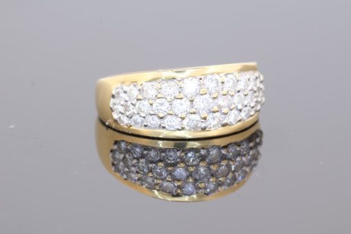 Elegant and versatile, this wide gold diamond band combines the warmth of precious gold with the refined sparkle of pavé-set diamonds. Its substantial profile gives the ring a confident presence, while the diamond detailing adds a touch of understated luxury.