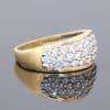Elegant and versatile, this wide gold diamond band combines the warmth of precious gold with the refined sparkle of pavé-set diamonds. Its substantial profile gives the ring a confident presence, while the diamond detailing adds a touch of understated luxury.