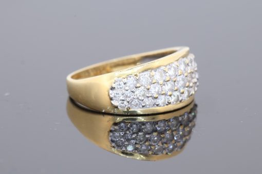 Elegant and versatile, this wide gold diamond band combines the warmth of precious gold with the refined sparkle of pavé-set diamonds. Its substantial profile gives the ring a confident presence, while the diamond detailing adds a touch of understated luxury.