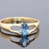 Elegant and distinctive, this 18kt gold ring showcases the captivating appeal of a beautiful teal-coloured gemstone. The rich blue-green hue offers a sophisticated alternative to more traditional gemstone colours, bringing depth and individuality to this fine jewellery piece.