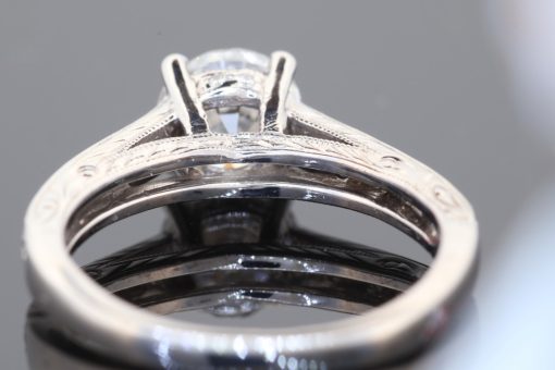 An elegant diamond ring showcasing the distinctive charm of the Old European cut, a style prized for its romantic character and beautifully individual sparkle. Set in platinum, this refined piece combines the enduring appeal of an antique-inspired diamond with intricate detailing and timeless sophistication.