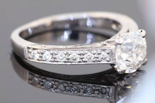 An elegant diamond ring showcasing the distinctive charm of the Old European cut, a style prized for its romantic character and beautifully individual sparkle. Set in platinum, this refined piece combines the enduring appeal of an antique-inspired diamond with intricate detailing and timeless sophistication.