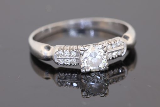 A rare antique diamond ring by Blackensee & Co. of England, dating to circa 1930. Reflecting the elegance of the period, this beautifully detailed jewel combines a central diamond with diamond-set shoulders, creating a sophisticated design with enduring appeal.