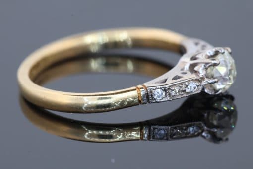 Dating to the antique period, this diamond engagement ring brings together the romantic character of an old-cut diamond and the enduring elegance of 18kt gold. Its classic design, enhanced by pavé-set shoulders, offers a beautiful expression of antique-inspired craftsmanship and timeless appeal.