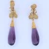 A spectacular antique amethyst parure, made in Italy circa 1880. An impressive suite of matching jewellery, showcasing the rich violet beauty of amethyst and the elaborate craftsmanship characteristic of late 19th-century Italian jewellery. Parures were particularly prized for their coordinated design, with matching pieces intended to be worn together for formal occasions. This exceptional suite is a wonderful example of the Victorian fascination with richly coloured gemstones and grand, coordinated jewels.