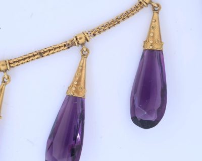 A spectacular antique amethyst parure, made in Italy circa 1880. An impressive suite of matching jewellery, showcasing the rich violet beauty of amethyst and the elaborate craftsmanship characteristic of late 19th-century Italian jewellery. Parures were particularly prized for their coordinated design, with matching pieces intended to be worn together for formal occasions. This exceptional suite is a wonderful example of the Victorian fascination with richly coloured gemstones and grand, coordinated jewels.