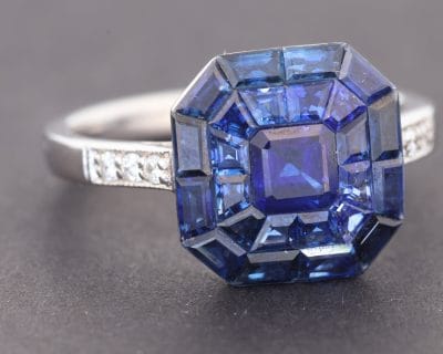 Elegant and contemporary, this sapphire ring showcases the rich colour of sapphires in a refined, modern setting. The invisible setting technique is admired for creating a seamless surface of gemstones, allowing the stones to form a striking, uninterrupted display of colour.