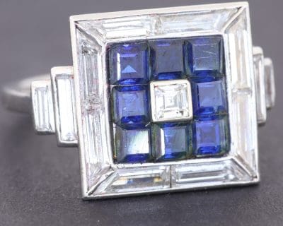 Dating to circa 1935, this Art Deco sapphire and diamond panel ring reflects the elegance and geometric sophistication of the period. Art Deco jewellery is celebrated for its architectural lines, balanced symmetry and striking combinations of precious gemstones, making pieces from this era enduring favourites among collectors of antique jewellery.