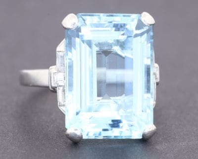 An elegant Art Deco aquamarine and diamond ring by Bailey Banks & Biddle, one of America's historic jewellery houses. The Art Deco period is celebrated for its geometric sophistication, refined proportions and striking use of precious gemstones. This ring brings together the cool, tranquil beauty of aquamarine and the enduring brilliance of diamonds in a design associated with the glamour of the era.