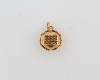 A wonderful antique Portuguese locket, crafted in 19-karat gold. Combining fine gold craftsmanship with an intimate, personal purpose, this distinctive jewel was designed to hold treasured photographs close, preserving memories within an elegant piece of antique jewellery.
