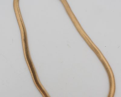A distinctive gold snake necklace, drawing on one of jewellery’s most enduring and evocative motifs. The serpent has long featured in jewellery design, symbolising renewal, transformation and eternity, making snake jewellery both visually striking and rich in symbolism.
