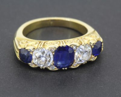 Dating to circa 1890, this rare antique sapphire and diamond five-stone ring is a beautiful example of late Victorian gemstone jewellery. The enduring combination of sapphires and diamonds brings together rich colour and brilliance in a timeless design.