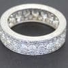 A rare antique diamond full eternity ring, distinguished by its substantial diamond weight and beautifully engraved sides. Combining the enduring brilliance of diamonds with the artistry of hand-engraved detailing, this is a characterful antique jewel with timeless appeal.