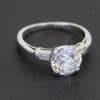 An elegant Art Deco diamond ring, combining the glamour of the 1920s and 1930s with the enduring appeal of an exceptional diamond. The Art Deco period is celebrated for its bold geometry, refined symmetry and sophisticated design, making jewellery from this era particularly desirable to collectors who appreciate distinctive craftsmanship and timeless style.