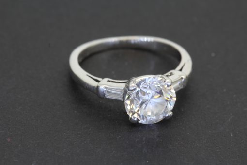 An elegant Art Deco diamond ring, combining the glamour of the 1920s and 1930s with the enduring appeal of an exceptional diamond. The Art Deco period is celebrated for its bold geometry, refined symmetry and sophisticated design, making jewellery from this era particularly desirable to collectors who appreciate distinctive craftsmanship and timeless style.