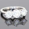 Elegant and timeless, this three-stone diamond ring combines the enduring beauty of diamonds with the refined sophistication of platinum. At its centre is a striking 0.91-carat diamond, graded E colour and SI1 clarity, complemented by two additional diamonds to create a beautifully balanced design with an impressive total diamond weight of 1.97 carats.