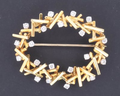 A striking Modernist diamond and gold brooch, made by Wests of Dublin, one of Ireland’s most distinguished jewellery houses. The brooch reflects the clean, sculptural aesthetic of Modernist jewellery, where traditional precious materials were interpreted through bold forms and a more contemporary approach to design.