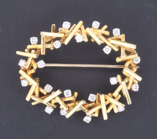 A striking Modernist diamond and gold brooch, made by Wests of Dublin, one of Ireland’s most distinguished jewellery houses. The brooch reflects the clean, sculptural aesthetic of Modernist jewellery, where traditional precious materials were interpreted through bold forms and a more contemporary approach to design.