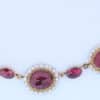 A remarkable antique parure of coral, garnet, cultured pearl, 18kt gold and gilded metal, associated with the Countess du Durat. An extraordinary and highly unusual suite comprising three tiaras, a necklace, a pair of ear pendants, a pair of ear clips and two bracelets. The parure is particularly evocative for its aristocratic association and the extraordinary breadth of the suite. The Comtesses de Durat belonged to a lineage whose history extended through one of the most turbulent periods of French history, navigating the upheavals of the French Revolution before re-establishing their position within aristocratic society during the Napoleonic era. The family also had a Caribbean branch connected with French colonial administration in territories including Grenada and Saint Martin, while members of the family in mainland France maintained important estates and family residences. Among the women associated with the lineage were Jeanne-Caroline de Patouillet de Deservillers and Marie Marguerite Henriette de Durat, figures remembered in regional records for their cultivation and erudition.
