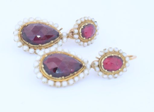 A remarkable antique parure of coral, garnet, cultured pearl, 18kt gold and gilded metal, associated with the Countess du Durat. An extraordinary and highly unusual suite comprising three tiaras, a necklace, a pair of ear pendants, a pair of ear clips and two bracelets. The parure is particularly evocative for its aristocratic association and the extraordinary breadth of the suite. The Comtesses de Durat belonged to a lineage whose history extended through one of the most turbulent periods of French history, navigating the upheavals of the French Revolution before re-establishing their position within aristocratic society during the Napoleonic era. The family also had a Caribbean branch connected with French colonial administration in territories including Grenada and Saint Martin, while members of the family in mainland France maintained important estates and family residences. Among the women associated with the lineage were Jeanne-Caroline de Patouillet de Deservillers and Marie Marguerite Henriette de Durat, figures remembered in regional records for their cultivation and erudition.