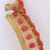 A remarkable antique parure of coral, garnet, cultured pearl, 18kt gold and gilded metal, associated with the Countess du Durat. An extraordinary and highly unusual suite comprising three tiaras, a necklace, a pair of ear pendants, a pair of ear clips and two bracelets. The parure is particularly evocative for its aristocratic association and the extraordinary breadth of the suite. The Comtesses de Durat belonged to a lineage whose history extended through one of the most turbulent periods of French history, navigating the upheavals of the French Revolution before re-establishing their position within aristocratic society during the Napoleonic era. The family also had a Caribbean branch connected with French colonial administration in territories including Grenada and Saint Martin, while members of the family in mainland France maintained important estates and family residences. Among the women associated with the lineage were Jeanne-Caroline de Patouillet de Deservillers and Marie Marguerite Henriette de Durat, figures remembered in regional records for their cultivation and erudition.