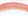 A remarkable antique parure of coral, garnet, cultured pearl, 18kt gold and gilded metal, associated with the Countess du Durat. An extraordinary and highly unusual suite comprising three tiaras, a necklace, a pair of ear pendants, a pair of ear clips and two bracelets. The parure is particularly evocative for its aristocratic association and the extraordinary breadth of the suite. The Comtesses de Durat belonged to a lineage whose history extended through one of the most turbulent periods of French history, navigating the upheavals of the French Revolution before re-establishing their position within aristocratic society during the Napoleonic era. The family also had a Caribbean branch connected with French colonial administration in territories including Grenada and Saint Martin, while members of the family in mainland France maintained important estates and family residences. Among the women associated with the lineage were Jeanne-Caroline de Patouillet de Deservillers and Marie Marguerite Henriette de Durat, figures remembered in regional records for their cultivation and erudition.