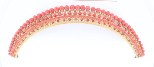 A remarkable antique parure of coral, garnet, cultured pearl, 18kt gold and gilded metal, associated with the Countess du Durat. An extraordinary and highly unusual suite comprising three tiaras, a necklace, a pair of ear pendants, a pair of ear clips and two bracelets. The parure is particularly evocative for its aristocratic association and the extraordinary breadth of the suite. The Comtesses de Durat belonged to a lineage whose history extended through one of the most turbulent periods of French history, navigating the upheavals of the French Revolution before re-establishing their position within aristocratic society during the Napoleonic era. The family also had a Caribbean branch connected with French colonial administration in territories including Grenada and Saint Martin, while members of the family in mainland France maintained important estates and family residences. Among the women associated with the lineage were Jeanne-Caroline de Patouillet de Deservillers and Marie Marguerite Henriette de Durat, figures remembered in regional records for their cultivation and erudition.