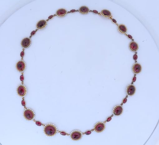 A remarkable antique parure of coral, garnet, cultured pearl, 18kt gold and gilded metal, associated with the Countess du Durat. An extraordinary and highly unusual suite comprising three tiaras, a necklace, a pair of ear pendants, a pair of ear clips and two bracelets. The parure is particularly evocative for its aristocratic association and the extraordinary breadth of the suite. The Comtesses de Durat belonged to a lineage whose history extended through one of the most turbulent periods of French history, navigating the upheavals of the French Revolution before re-establishing their position within aristocratic society during the Napoleonic era. The family also had a Caribbean branch connected with French colonial administration in territories including Grenada and Saint Martin, while members of the family in mainland France maintained important estates and family residences. Among the women associated with the lineage were Jeanne-Caroline de Patouillet de Deservillers and Marie Marguerite Henriette de Durat, figures remembered in regional records for their cultivation and erudition.