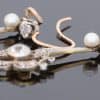 A beautiful pair of antique Belle Époque diamond and pearl drop earrings, dating to circa 1910. Elegant and refined, they capture the graceful femininity of the period, when delicate diamond jewellery and the soft lustre of pearls were particularly fashionable.