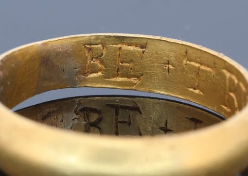 An extremely rare Tudor gold posy ring, engraved to the interior with the wonderfully intimate inscription “BE TRVE IN HART”, meaning “Be true in heart.” The ring was found by a metal detectorist in Shropshire in October 2024, adding a remarkable modern chapter to its long history. Posy rings were deeply personal jewels, traditionally engraved with short expressions of love, loyalty or devotion, and this inscription is particularly evocative in its simplicity. Examples bearing this distinctive Gothic-style lettering tend to date to around 1600, placing this ring at a fascinating point between the Tudor and early Stuart periods. Comparable examples can be found in the collections of both the British Museum and the Victoria and Albert Museum.