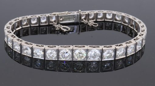 A magnificent antique Edwardian diamond line bracelet, dating to circa 1910 and exemplifying the refined elegance of early 20th-century diamond jewellery. The bracelet is set with an impressive ten carats of Old European-cut diamonds, creating an exceptionally rich and continuous line of diamond. The use of Old European-cut stones gives the bracelet a wonderfully romantic character, with the broad, lively facets producing the distinctive scintillation associated with diamonds of the period.
