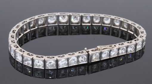 A magnificent antique Edwardian diamond line bracelet, dating to circa 1910 and exemplifying the refined elegance of early 20th-century diamond jewellery. The bracelet is set with an impressive ten carats of Old European-cut diamonds, creating an exceptionally rich and continuous line of diamond. The use of Old European-cut stones gives the bracelet a wonderfully romantic character, with the broad, lively facets producing the distinctive scintillation associated with diamonds of the period.