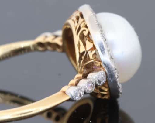 An extremely rare natural pearl and diamond cluster ring, made in Paris circa 1910. The ring centres on a beautiful natural pearl, accompanied by a Gem Lab certificate confirming its natural origin. The combination of natural pearl, diamonds and 18kt gold is characteristic of the refined French jewellery of the early 20th century, when natural pearls were among the most coveted gems in fine jewellery.
