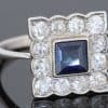 A charming antique sapphire and diamond cluster ring, dating to circa 1923, set in platinum and carrying a wonderfully personal inscription inside the shank: “FHB to Gwen 1923”. The dated dedication gives this elegant jewel a tangible connection to its original owners, transforming it from a beautiful piece of jewellery into a small piece of personal history. The inscription suggests that the ring was presented to Gwen in 1923, making it particularly evocative as a period gift.
