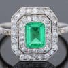A beautiful Belle Époque emerald and diamond cluster ring, made in France circa 1910 and showcasing the period’s love of delicate platinum construction, fine diamonds and richly coloured gemstones. At its centre is a superb 1-carat Colombian emerald, surrounded by a double halo of diamonds that enhances the stone’s natural colour and gives the ring an elegant, balanced appearance.